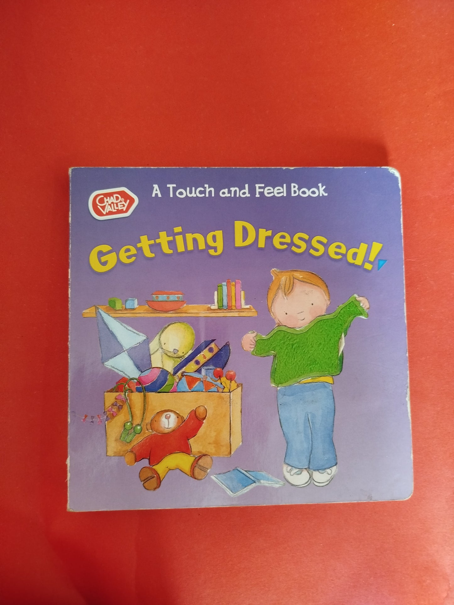 Getting Dressed (Touch and Feel Book)